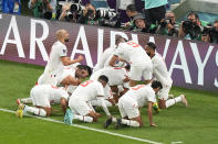 Morocco's Abdelhamid Sabiri celebrates with his teammates after scoring his side's first goal during the World Cup group F soccer match between Belgium and Morocco, at the Al Thumama Stadium in Doha, Qatar, Sunday, Nov. 27, 2022. (AP Photo/Pavel Golovkin)