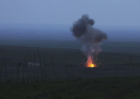 Smoke from fire rises above the ground in Martakert province, after an unmanned military air vehicle was shot down by the self-defense army of Nagorno-Karabakh according to Armenian media, during clashes over the breakaway Nagorno-Karabakh region, April 4, 2016. REUTERS/Vahram Baghdasaryan/Photolure