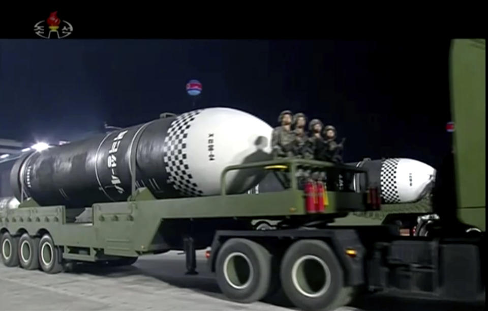 This image made from video broadcasted by North Korea's KRT, shows a military parade with what appears to be a possible new solid-fuel missile at the Kim Il Sung Square in Pyongyang, Saturday, Oct. 10, 2020. North Korean leader Kim Jong Un warned Saturday that his country would “fully mobilize” its nuclear force if threatened as he took center stage at a massive military parade to mark the 75th anniversary of the country’s ruling party. (KRT via AP)