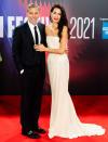 <p>George and Amal Clooney light up <em>The Tender Bar</em> premiere red carpet during the 65th BFI London Film Festival on Oct. 10.</p>