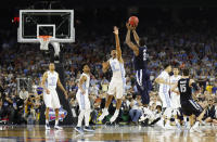 FILE - In this April 4, 2016, file photo, Villanova's Kris Jenkins makes the game-winning three-point shot during the second half of the NCAA Final Four tournament college basketball championship game against North Carolina, in Houston. (AP Photo/David J. Phillip)