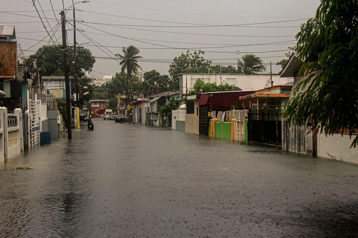 A flooded road is seen during the passage of Hurricane Fiona in Villa Blanca, Puerto Rico.