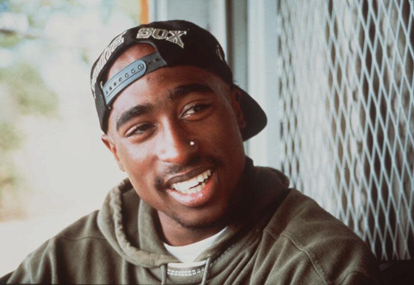 Tupac is smiling because Mr. Mister just came on. (AP Photo)
