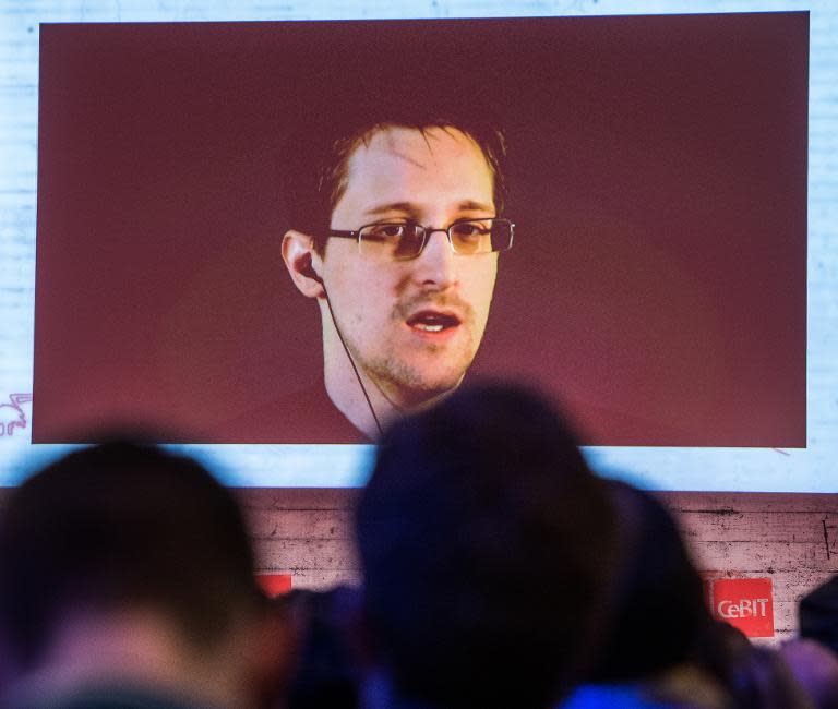 US National Security Agency whistleblower Edward Snowden speaks via live video call during the CeBIT technology fair in Hanover, Germany, on March 18, 2015