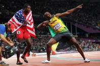 Bronze medalist Justin Gatlin of the United States and gold medalist Usain Bolt of Jamaica celebrate after competing in the Men?s 100m Final on Day 9 of the London 2012 Olympic Games at the Olympic Stadium on August 5, 2012 in London, England. (Photo by Michael Steele/Getty Images)