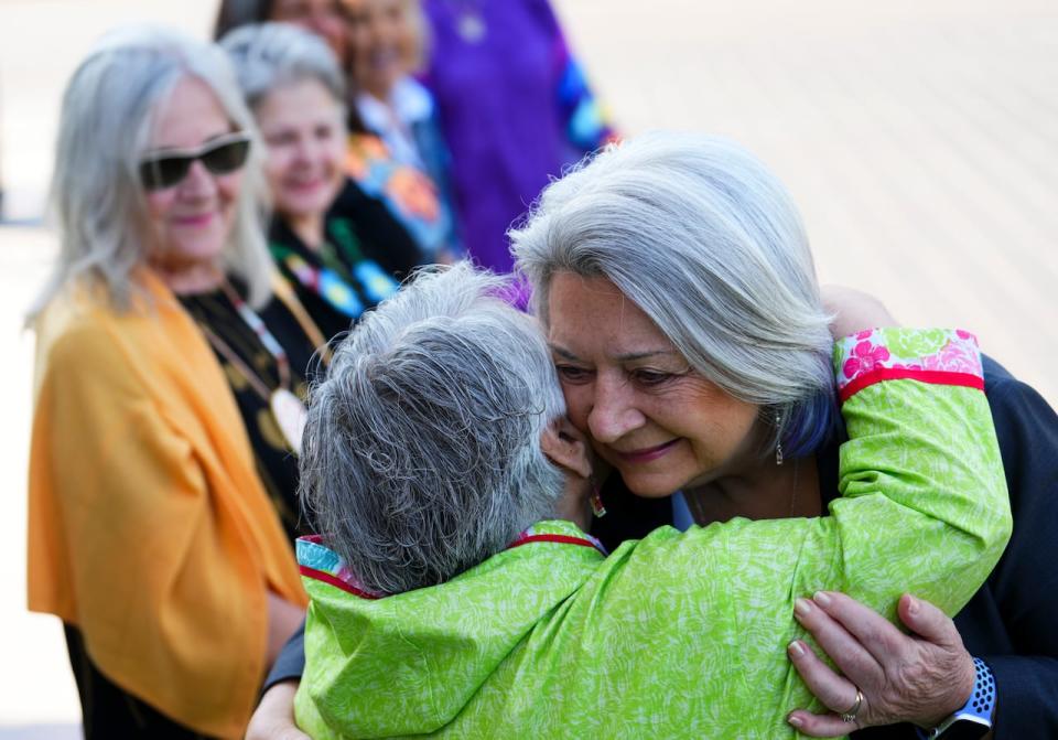 Governor General Mary Simon hugs residential school survivor Navalik Tologanak as they take part in the site selection ceremony of the Residential Schools National Monument on Parliament Hill in Ottawa on Tuesday, June 20, 2023.