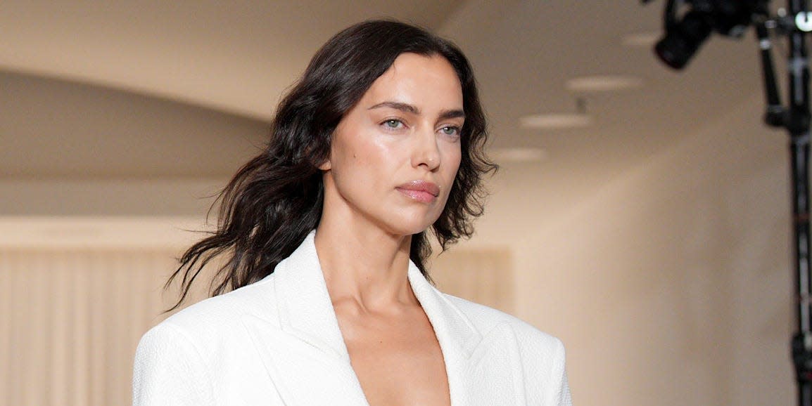 irina shayk closes andreas kronthaler for vivienne westwood ss25 at paris fashion week in a white suit