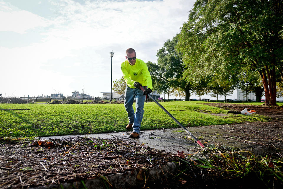 Kenny Wiggins works to clean city sidewalks around Waterfront Park in Charleston, S.C. following Tropical Storm Idalia on Aug. 31, 2023.  (Michael Wiser for NBC News)