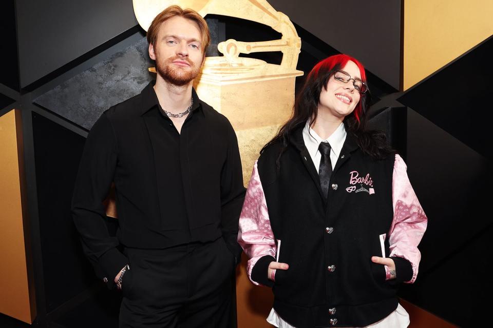 <p>Kevin Mazur/Getty Images for The Recording Academy</p> FINNEAS and Billie Eilish attend the GRAMMY Awards in Los Angeles in February 2024