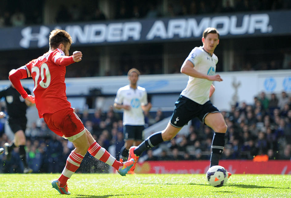 Southampton's Adam Lallana, left, scores his team's second goal of the game during the English Premier League soccer match against Tottenham Hotspurs at White Hart Lane, London Sunday March 23, 2014. (AP {Photo/Adam Davy/PA) UNITED KINGDOM OUT