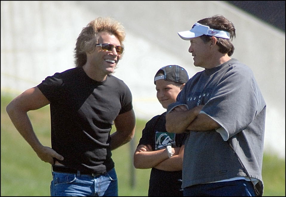 (8/14/06- Foxboro, MA Patriots practice Monday morning at Gillette Stadium. Jon Bon Jovi with son Jesse talk with Bill Belichick during the practice. Staff photo by Ted Fitzgerald - saved Photo Tuesday/Photo Max (Photo by Ted Fitzgerald/MediaNews Group/Boston Herald via Getty Images)