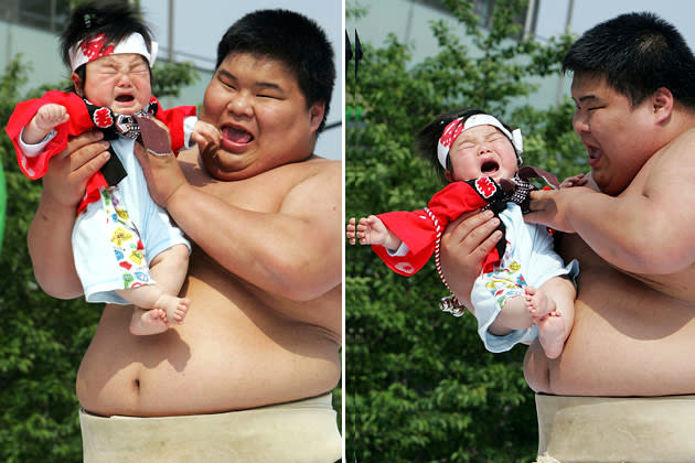 TOKYO - APRIL 28: Sumo wrestling students hold babies as they try to make them cry during the Crying Sumo competition at Sensoji Temple on April 28, 2007 in Tokyo, Japan. The first baby to cry wins the competition. The ceremony takes place in Japan to wish for the good health of the child as it is said that crying is good for the health of babies. (Photo by Junko Kimura/Getty Images)