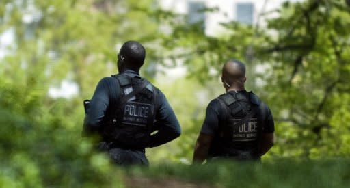 This file photo shows US Secret Service police standing guard on the North Lawn of the White House, in 2009. US President Barack Obama on Sunday said he expected a "rigorous" probe into a sex scandal involving Secret Service agents, warning he would be "angry" if the claims were proven true