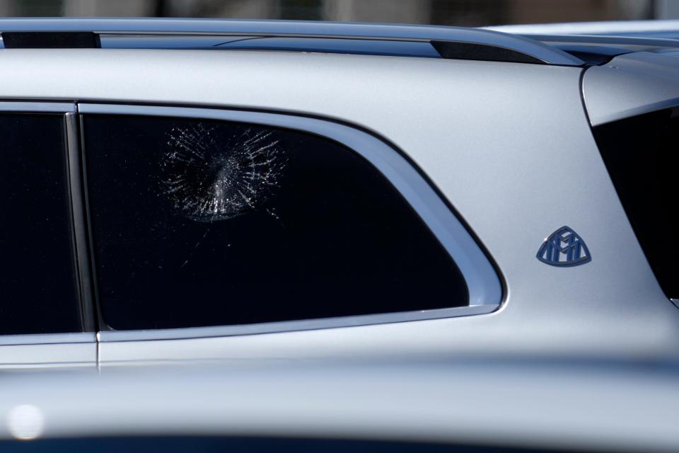 Shattered glass marks the spot where a foul ball off of the bat of Cincinnati Reds infielder Elly De La Cruz (44) broke the window of Hunter Greene’s SUV on a pitch delivered by Greene during a live batting practice sessions at the Cincinnati Reds player development complex in Goodyear, Ariz., on Tuesday.