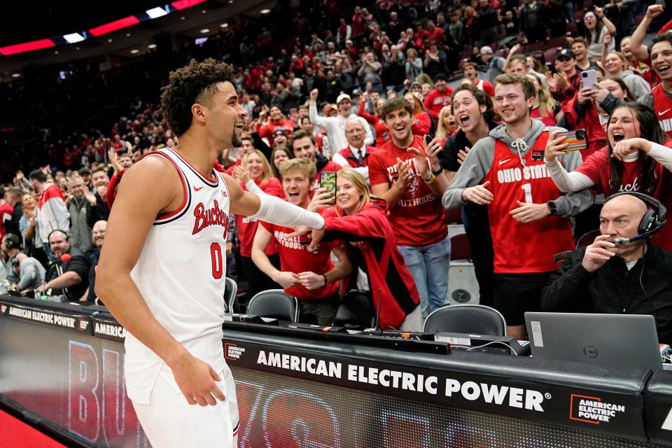 Dec 8, 2022; Columbus, OH, USA;  Ohio State Buckeyes guard Tanner Holden (0) celebrates a buzzer beater that gave the Buckeyes a 67-66 win over the Rutgers Scarlet Knights in the NCAA men's basketball game at Value City Arena. Mandatory Credit: Adam Cairns-The Columbus Dispatch