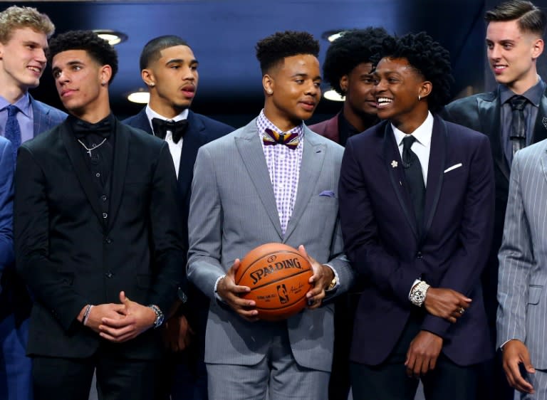 Potential top draftees (front row, from L) Lonzo Ball, Markelle Fultz and De'Aaron Fox stand before the first round of the 2017 NBA Draft, at Barclays Center in New York, on June 22