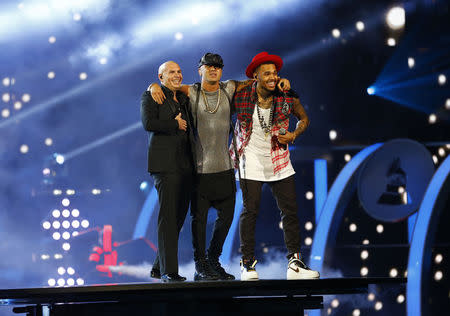 Wisen (C) performs "Control" with Chris Brown (R) and Pitbull. REUTERS/Mike Blake