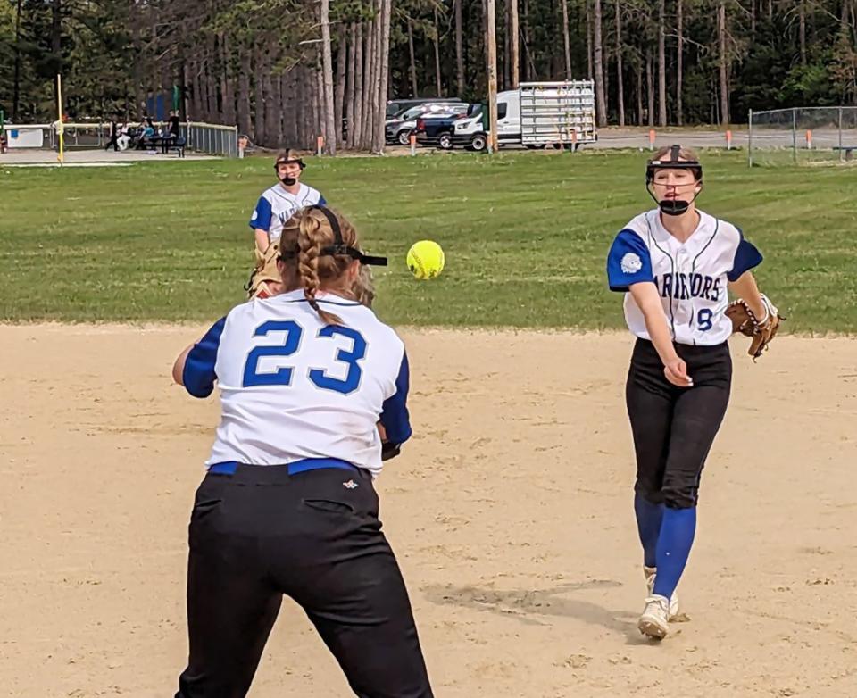 Narragansett second baseman Mia Manca flips the ball to first baseman Amanda Iannacone (23) to retire Gardner High's Allie Fitzsimmons during Monday's game at Gilman Waite Field in Baldwinville.