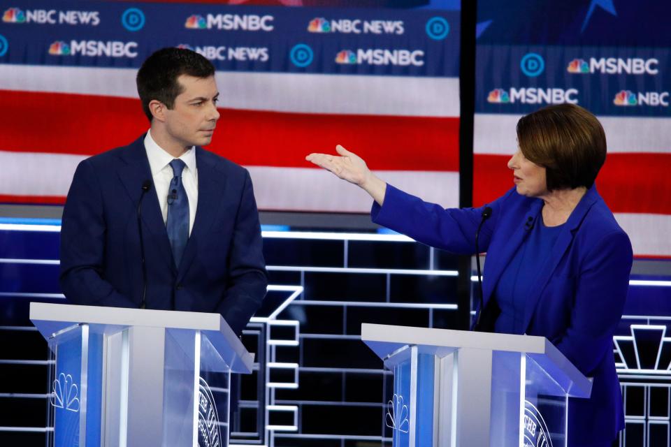 Democratic presidential candidates, Sen. Amy Klobuchar, D-Minn., right, speaks as former South Bend Mayor Pete Buttigieg looks on during a Democratic presidential primary debate Wednesday, Feb. 19, 2020, in Las Vegas, hosted by NBC News and MSNBC. (AP Photo/John Locher)