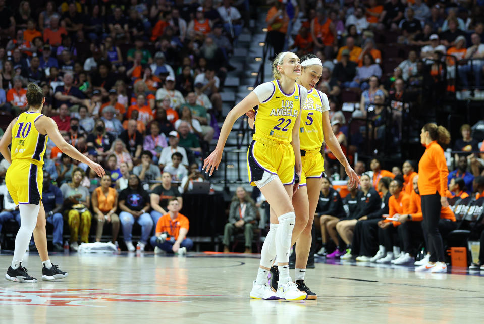 UNCASVILLE, CONNECTICUT – JUNE 18: Los Angeles Sparks forward Cameron Brink (22) is injured and is helped off the court by Los Angeles Sparks forward Dearica Hamby (5) during a WNBA game between the Los Angeles Sparks and the Connecticut Sun at Mohegan Sun Arena in Uncasville, Connecticut on June 18, 2024. (Photo by M. Anthony Nesmith/Icon Sportswire via Getty Images)