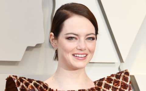 A dark-haired Emma Stone shines at the Oscars - Credit: Mark Ralston/AFP