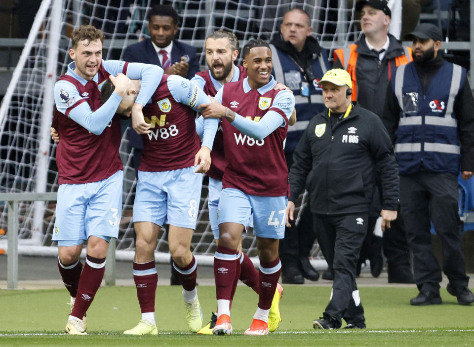 Burnley's Josh Brownhill, second left, celebrates scoring their side's first goal of the game during the Premier League match at Turf Moor, Burnley, England, Saturday April 13, 2024. (Richard Sellers/PA via AP)