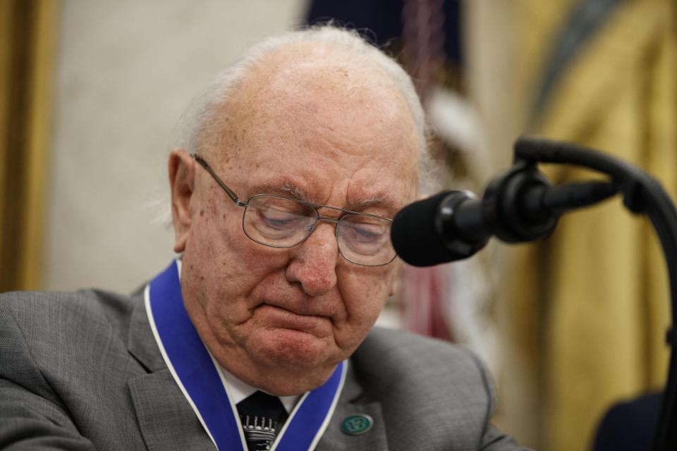 Former NBA basketball player and coach Bob Cousy, of the Boston Celtics, pauses while speaking as President Donald Trump stands, during a Presidential Medal of Freedom ceremony for Cousy, in the Oval Office of the White House, Thursday, Aug. 22, 2019, in Washington. (AP Photo/Alex Brandon)