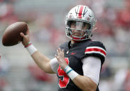 FILE - Ohio State quarterback Jack Miller throws on the sideline during an NCAA college spring football game in Columbus, Ohio, in this Saturday, April 17, 2021, file photo. Third-year Ohio State coach Ryan Day opens a preseason camp for the first time without a good idea of who will be the starting quarterback.(AP Photo/Paul Vernon, File)