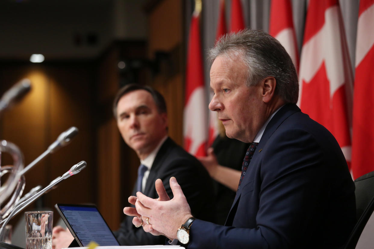 Bank of Canada Governor Stephen Poloz (R) and Finance Minister Bill Morneau (L) speaksduring a news conference on Parliament Hill March 18, 2020 in Ottawa, Ontario. - Canadian Prime Minister Justin Trudeau announced Can$27 billion in direct aid on March 18, 2020 to help workers and businesses cope with the economic impacts of the coronavirus pandemic.He said tax payments worth an estimated Can$55 billion could be deferred until August. (Photo by Dave Chan / AFP) (Photo by DAVE CHAN/AFP via Getty Images)