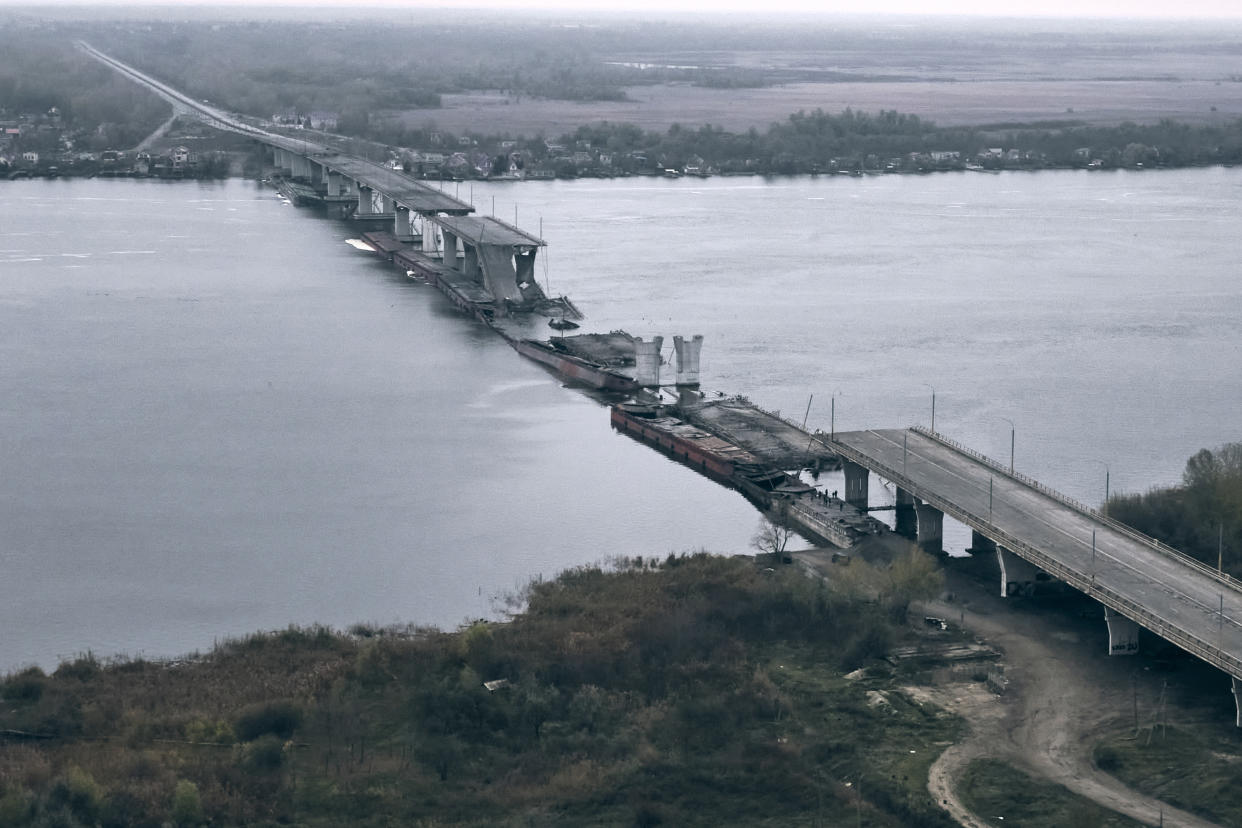 A view of the damaged Antonovsky bridge over the Dnipro river in Kherson.