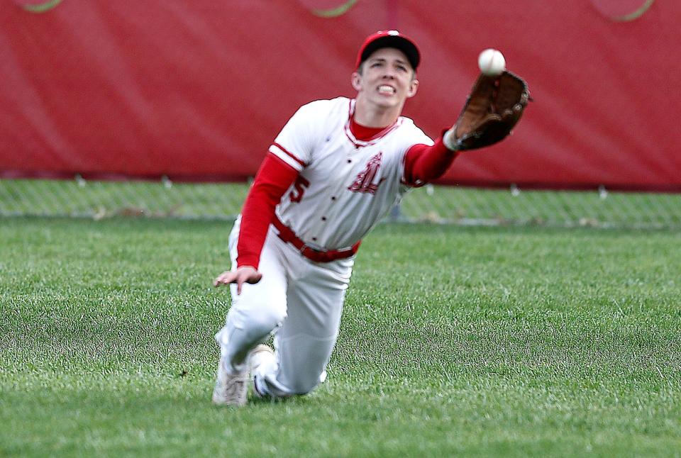 Loudonville centerfielder Baylor Weiser (5) makes a diving catch on a ball hit by Mapleton's Ajay Workman Thursday, April 6, 2023, at Loudonville High School.