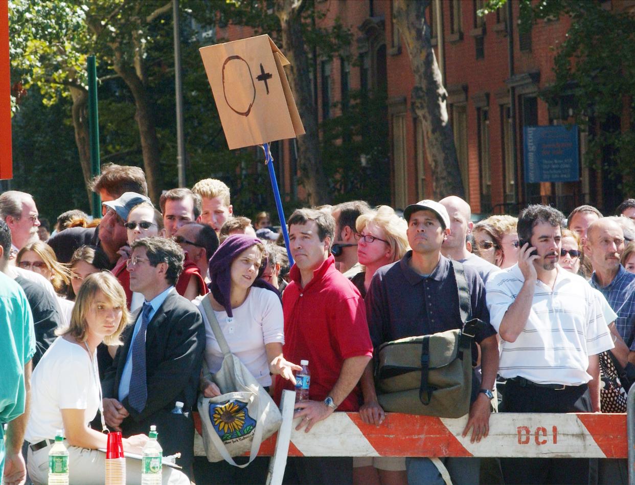 People line up with their blood types at St. Vincent Hospital September 11, 2001 in New York City after two airplanes slammed into the twin towers in an alleged terrorist attack.