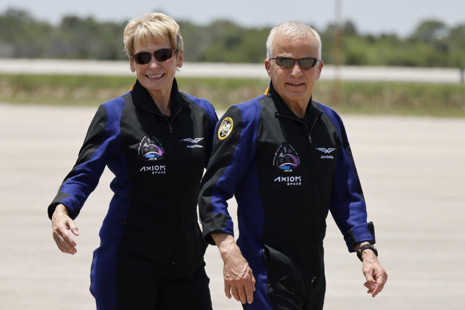 Members of the crew of the SpaceX Falcon 9 rocket, with the Crew Dragon spacecraft, commandeer Peggy Whitson, left, and pilot John Shoffner arrive at the Kennedy Space Center in Cape Canaveral, Fla., before their launch to the International Space Station, Sunday, May 21, 2023. (AP Photo/Terry Renna) Peggy Whitson