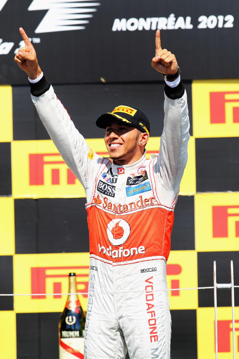 MONTREAL, CANADA - JUNE 10: Lewis Hamilton of Great Britain and McLaren celebrates on the podium after winning the Canadian Formula One Grand Prix at the Circuit Gilles Villeneuve on June 10, 2012 in Montreal, Canada. (Photo by Mark Thompson/Getty Images)