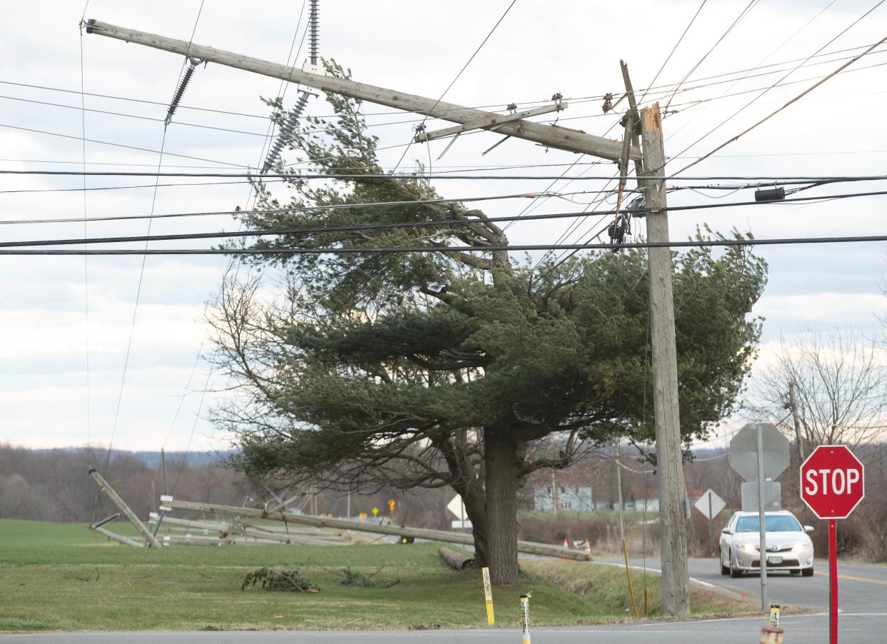 High winds snapped utility poles at Wooster Street near Alabama Avenue in Tuscarawas Township on Saturday.