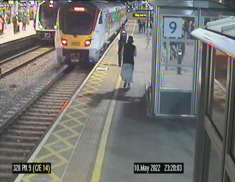 Matthew King on a train station platform behind a police officer (Metropolitan Police/PA Wire)