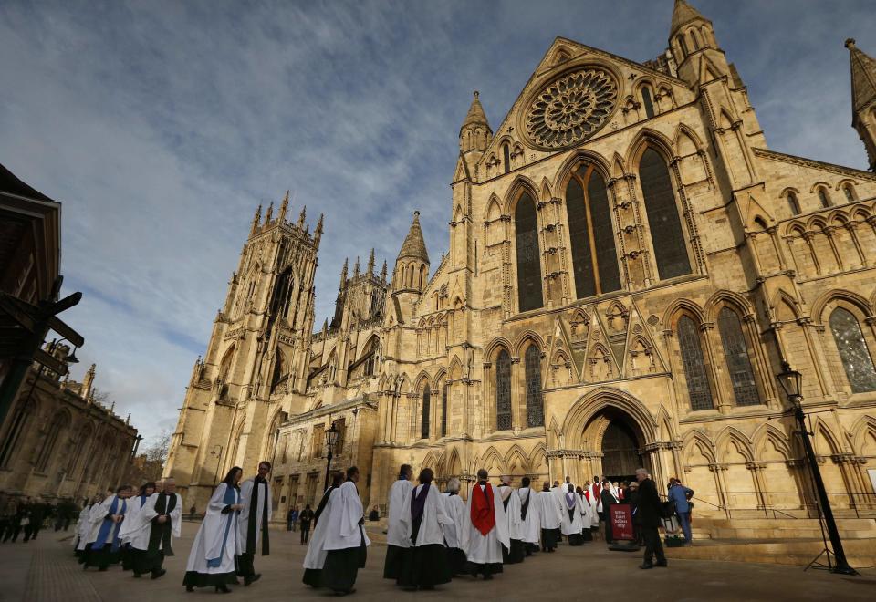 Members of the clergy enter York Minster before a service to consecrate Reverend Libby Lane as the first female bishop in the Church of England, in Yor