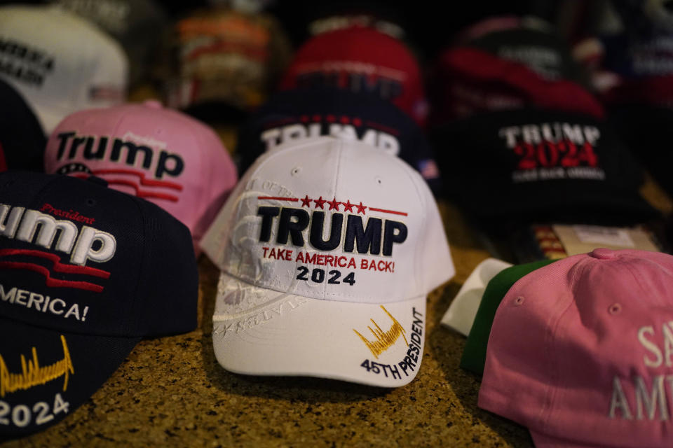 Hats with campaign slogans are sold before a speech by former President Donald Trump at the California Republican Party Convention, Friday, Sept. 29, 2023, in Anaheim, Calif. (AP Photo/Jae C. Hong)