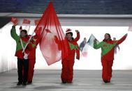 Morocco's flag-bearer Adam Lamhamedi leads his country's contingent during the athletes' parade at the opening ceremony of the 2014 Sochi Winter Olympics, February 7, 2014. REUTERS/Phil Noble (RUSSIA - Tags: OLYMPICS SPORT)
