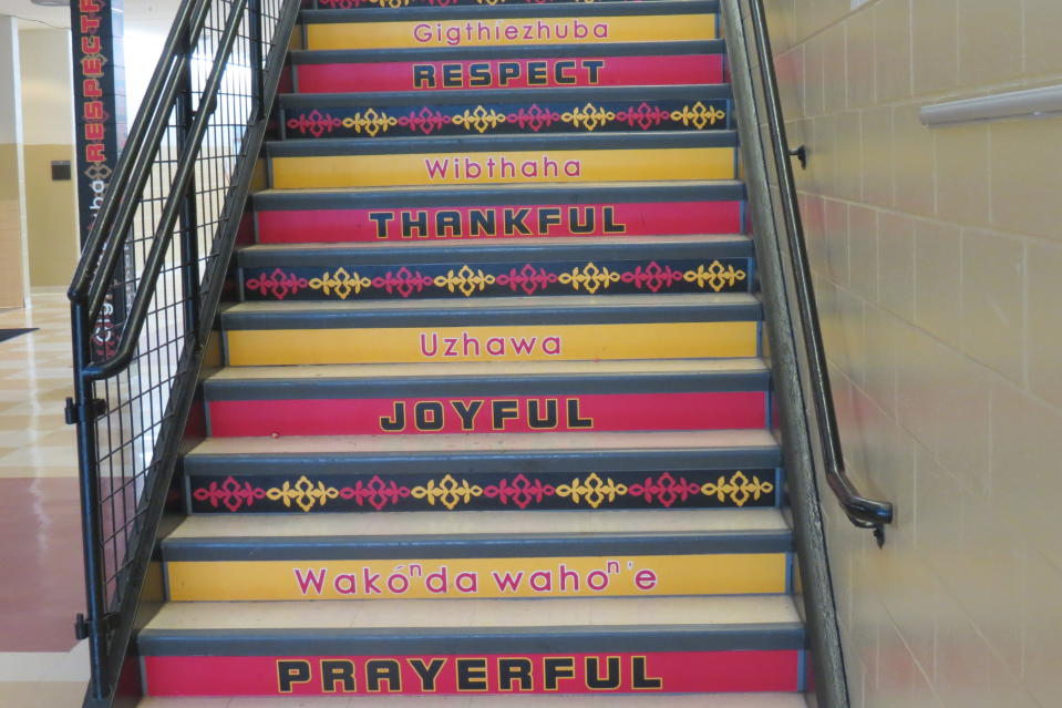 Stairs in Umonhon Nation Public School with words in English and Umonhon.