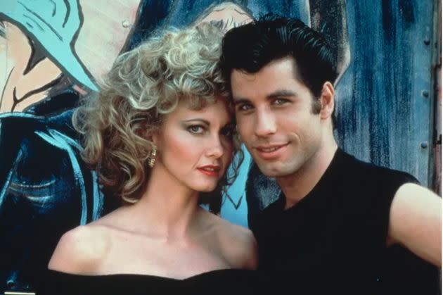 Olivia on the set of Grease in 1978 with John Travolta. (Photo: PARAMOUNT PICTURES VIA GETTY IMAGES)