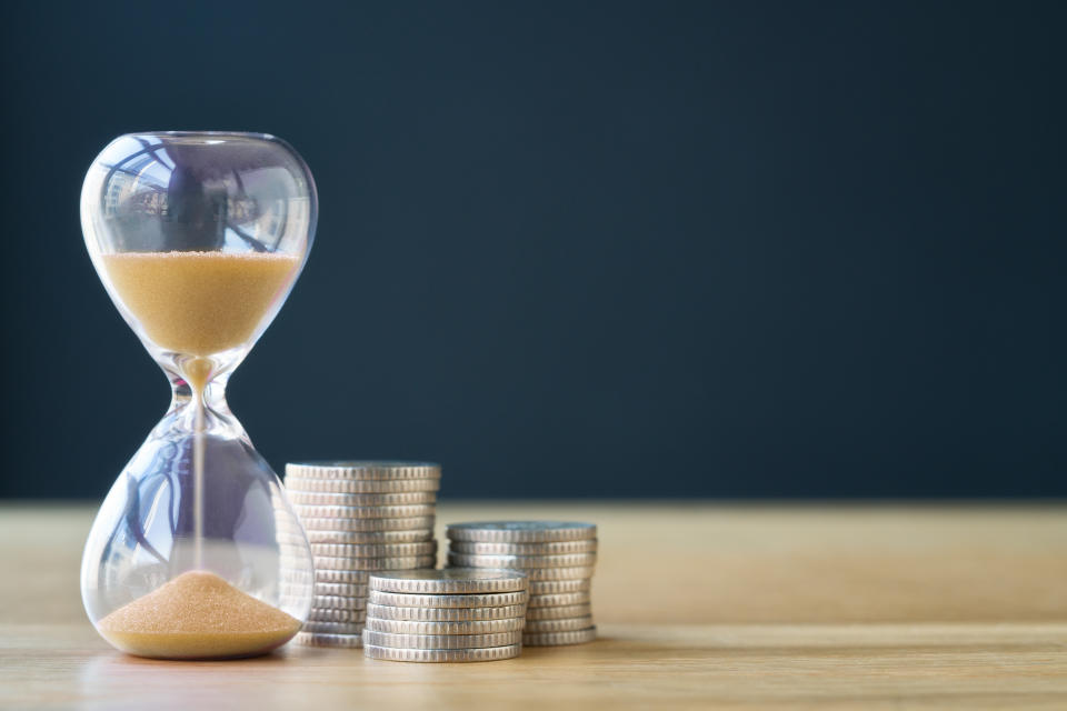 Time and stack of coins.