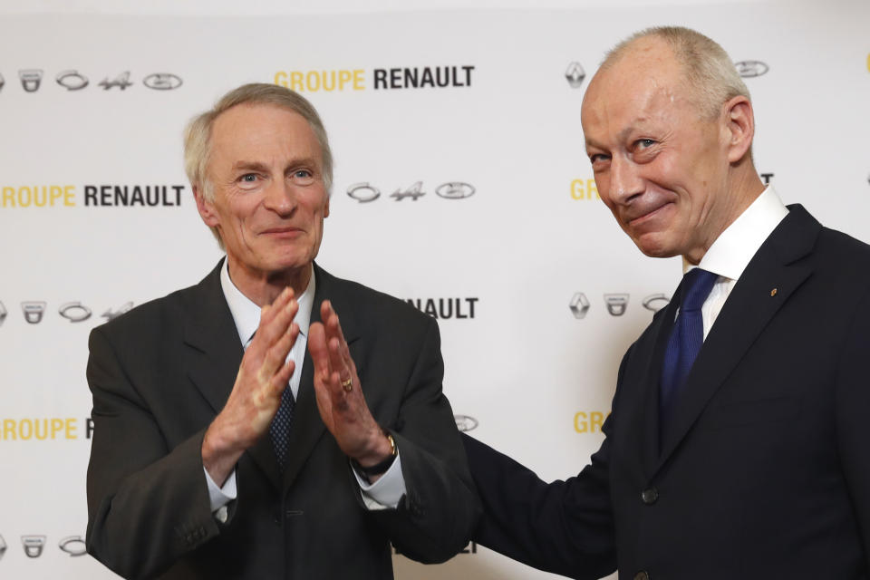 Jean-Dominique Senard, left, poses with Renault CEO Thierry Bollore after being appointed Renault chairman following a meeting of the board held at Renault headquarters in Boulogne-Billancourt, outside Paris, France, Thursday, Jan. 24, 2019. The board of French carmaker Renault has chosen new leadership to replace industry veteran Carlos Ghosn, naming Jean-Dominique Senard as chairman and Renault executive Thierry Bollore as CEO. (AP Photo/Christophe Ena)