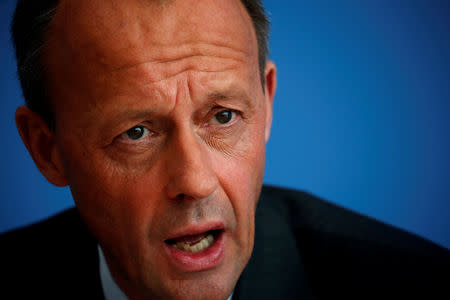 FILE PHOTO: German conservative Friedrich Merz from CDU holds a news conference about his candidacy to succeed Chancellor Angela Merkel as leader of the Christian Democrats, in Berlin, Germany October 31, 2018. REUTERS/Hannibal Hanschke/File Photo