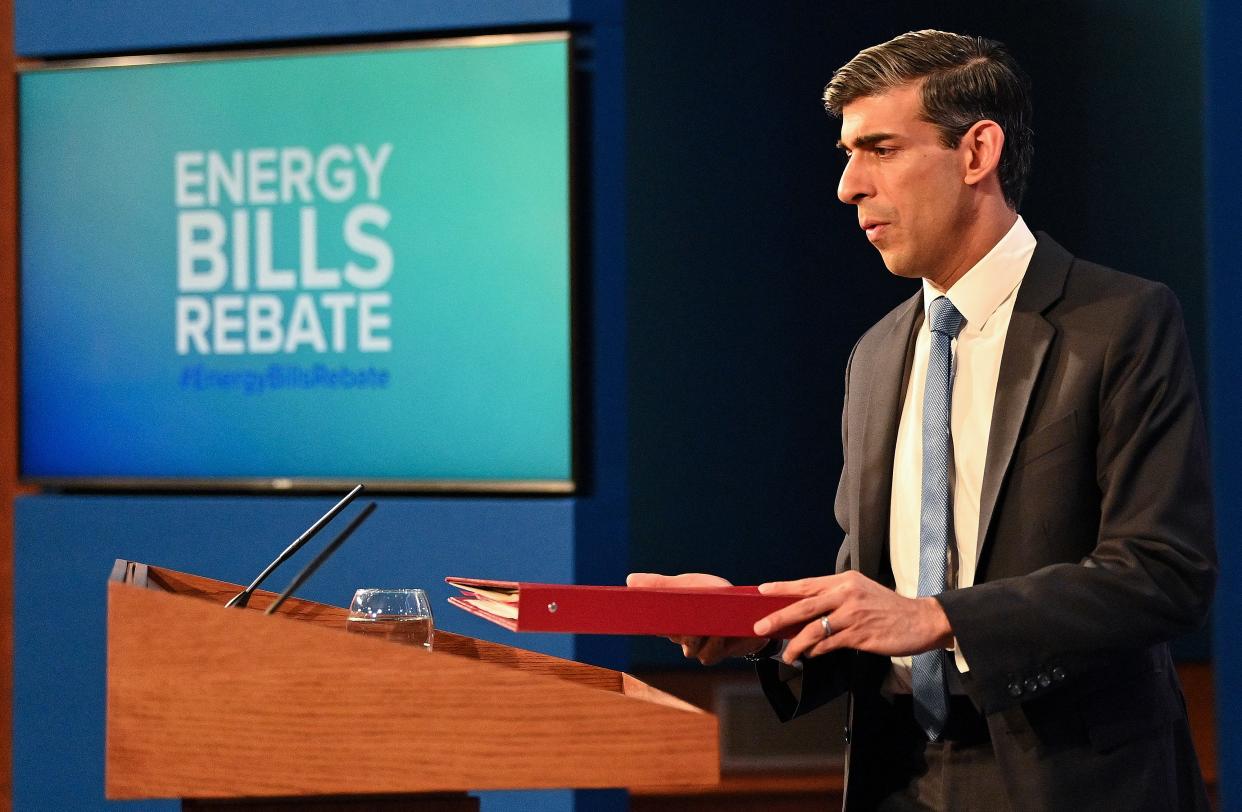 Britain's Chancellor of the Exchequer Rishi Sunak hosts a press conference in the Downing Street Briefing Room on February 3, 2022. - The UK government on Thursday stepped in to help the hardest-hit households struggling with the rising cost of living, announcing a £9 billion package to offset soaring energy bills. It followed an announcement by that energy regulator that the price cap on how much suppliers can charge consumers will jump by 54 percent due to soaring wholesale gas prices. (Photo by JUSTIN TALLIS / various sources / AFP) (Photo by JUSTIN TALLIS/AFP via Getty Images)