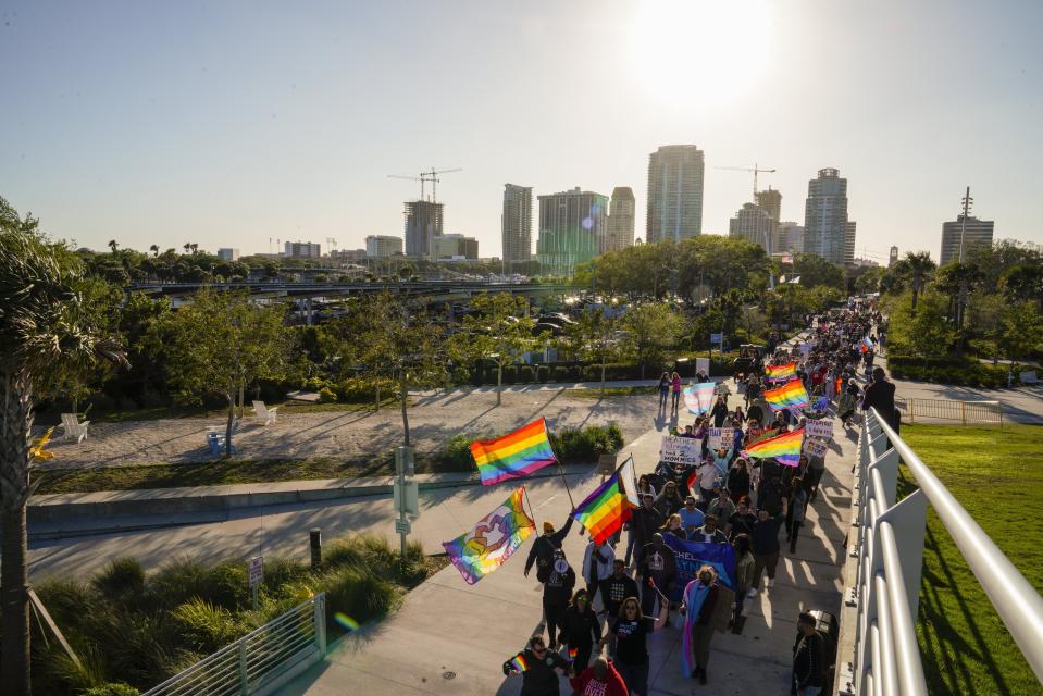 FILE - People march toward the St. Pete Pier in St. Petersburg, Fla., on March 12, 2022, during a protest against the controversial "Don't Say Gay" bill passed by Florida's Republican-led legislature. The Florida Board of Education on Wednesday, April 19, 2023, approved a ban on classroom instruction about sexual orientation and gender identity in all grades, expanding the law critics call “Don't Say Gay” at the request of Gov. Ron DeSantis as he gears up for an expected presidential run. (Martha Asencio-Rhine/Tampa Bay Times via AP, File)