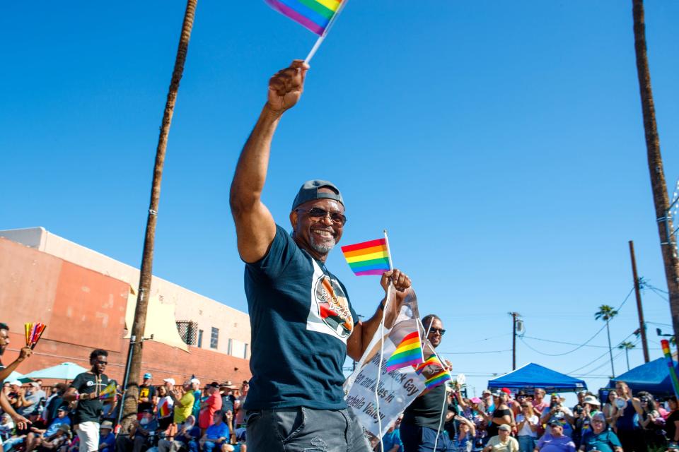 Yvans Jourdain marches in the Greater Palm Springs Pride Parade in downtown Palm Springs, Calif., on Sunday, Nov. 6, 2022. 