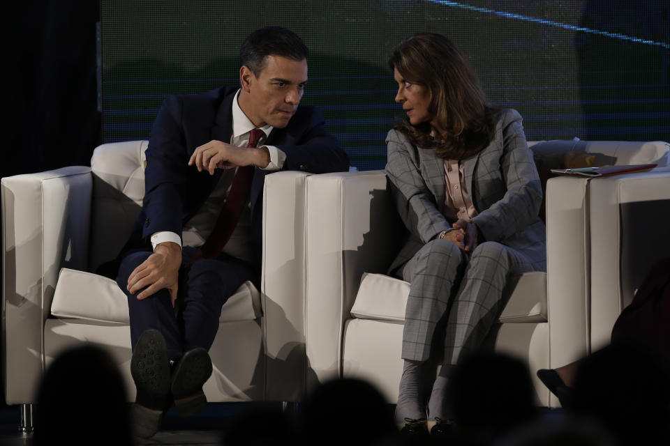 Spain's Prime Minister Pedro Sanchez, left, and Colombia's Vice President Marta Lucia Ramirez talk during an economic forum as part the XXVI Iberoamerican Summit in Antigua, Guatemala, Thursday, Nov. 15, 2018. The event is a biennial two-day meeting of heads of state from Latin America and the Iberian Peninsula. (AP Photo/Moises Castillo)