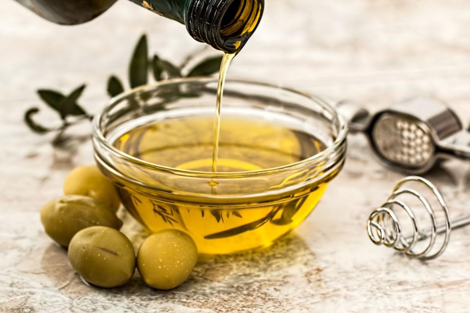 <p>“It may seem like a contradiction, but the more good fats—like olive oil and avocadoes—that you eat, the more weight you will lose,” says <a href="https://drgundry.com/" rel="nofollow noopener" target="_blank" data-ylk="slk:Steven Gundry;elm:context_link;itc:0;sec:content-canvas" class="link ">Steven Gundry</a>, M.D., medical director at <a href="https://www.ifm.org/about/profile/steven-gundry-md/" rel="nofollow noopener" target="_blank" data-ylk="slk:The International Heart and Lung Institute Center for Restorative Medicine;elm:context_link;itc:0;sec:content-canvas" class="link ">The International Heart and Lung Institute Center for Restorative Medicine</a> and author of several books including <em><a href="https://www.amazon.com/Plant-Paradox-Dangers-Healthy-Disease/dp/006242713X/?tag=syn-yahoo-20&ascsubtag=%5Bartid%7C10050.g.35715141%5Bsrc%7Cyahoo-us" rel="nofollow noopener" target="_blank" data-ylk="slk:The Plant Paradox;elm:context_link;itc:0;sec:content-canvas" class="link ">The Plant Paradox</a></em>. “These fats promote the production of appetite-suppressing hormones that tell your brain that you are full.”</p>