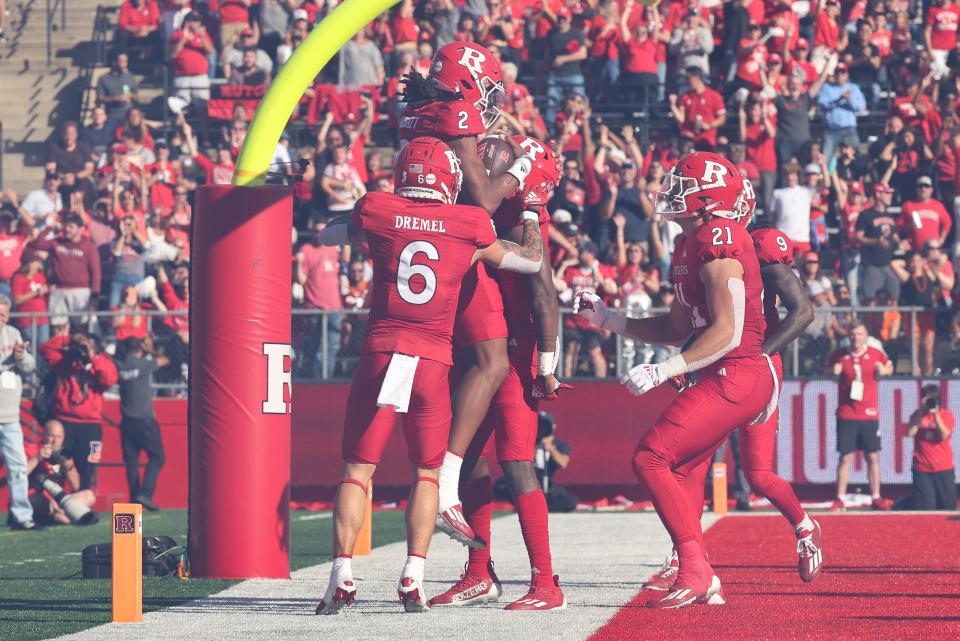 Sep 16, 2023; Piscataway, New Jersey, USA; Rutgers Scarlet Knights quarterback Gavin Wimsatt (2) celebrates his rushing touchdown with teammates during the first half against the Virginia Tech Hokies at SHI Stadium. Mandatory Credit: Vincent Carchietta-USA TODAY Sports